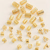 A collection of elegant gold hollow hair rings used for braids.