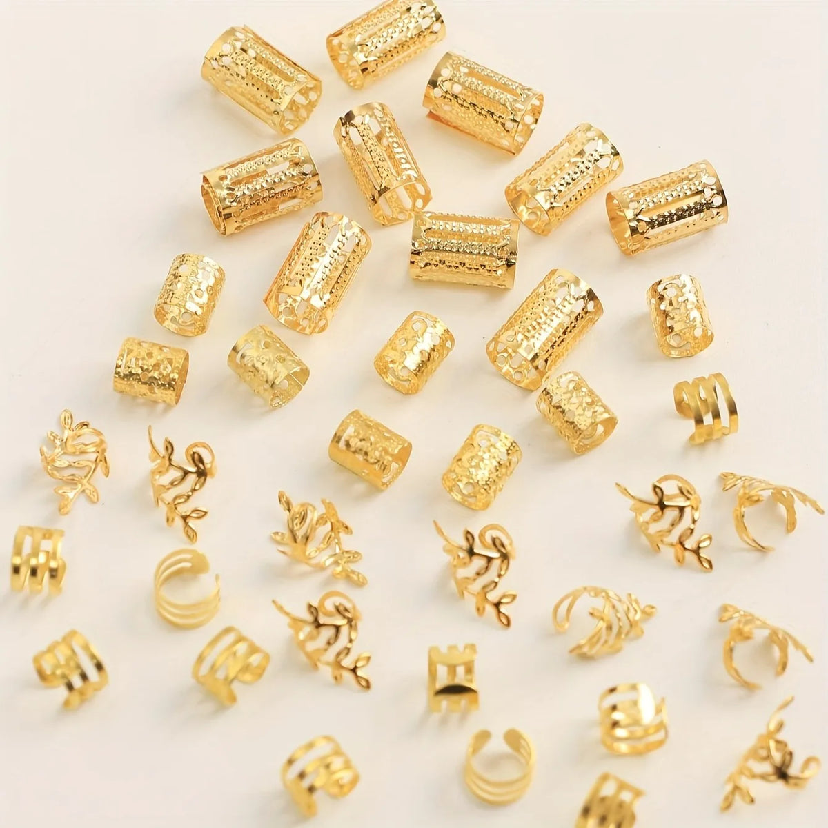 A collection of elegant gold hollow hair rings used for braids.
