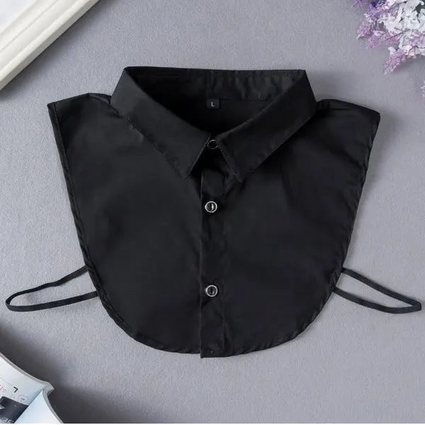 Black elegant detachable button-up collar shirt laid flat on a gray surface.