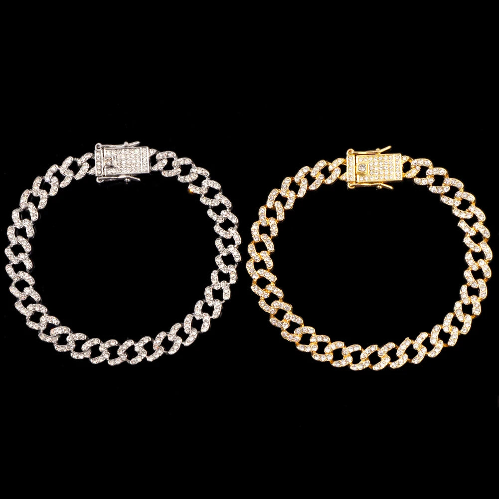 A pair of crystal Cuban link anklets, featuring gold and silver options.