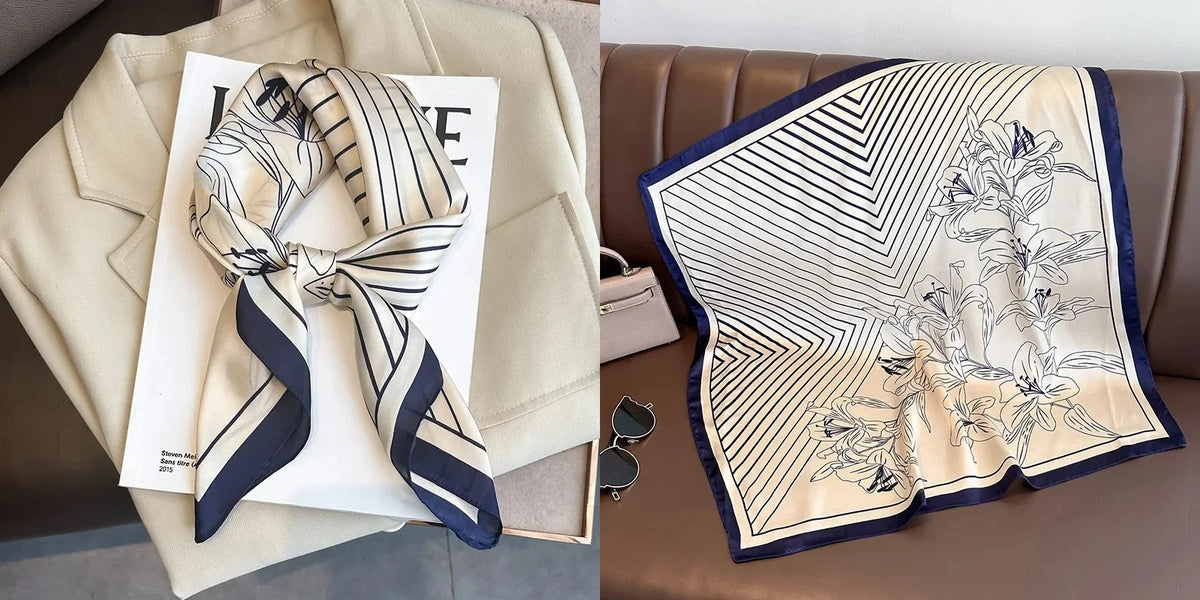A beige blazer with a navy and white striped silk scarf draped over it, next to a folded white card.