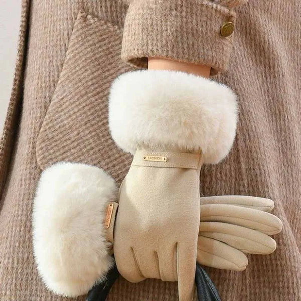 Tan plush wrist gloves with white faux fur cuffs worn on a person's hand.