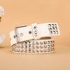 A beige leather belt featuring silver metal rivets and studs, shown flat on a neutral background.