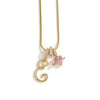A gold-toned alphabet flower pendant necklace with a pink gemstone charm.