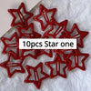A set of ten red star snap clips for hair and barrettes.