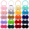 A collection of colorful double plush elastic hair bands for girls in various shades including pink, white, yellow, green, or