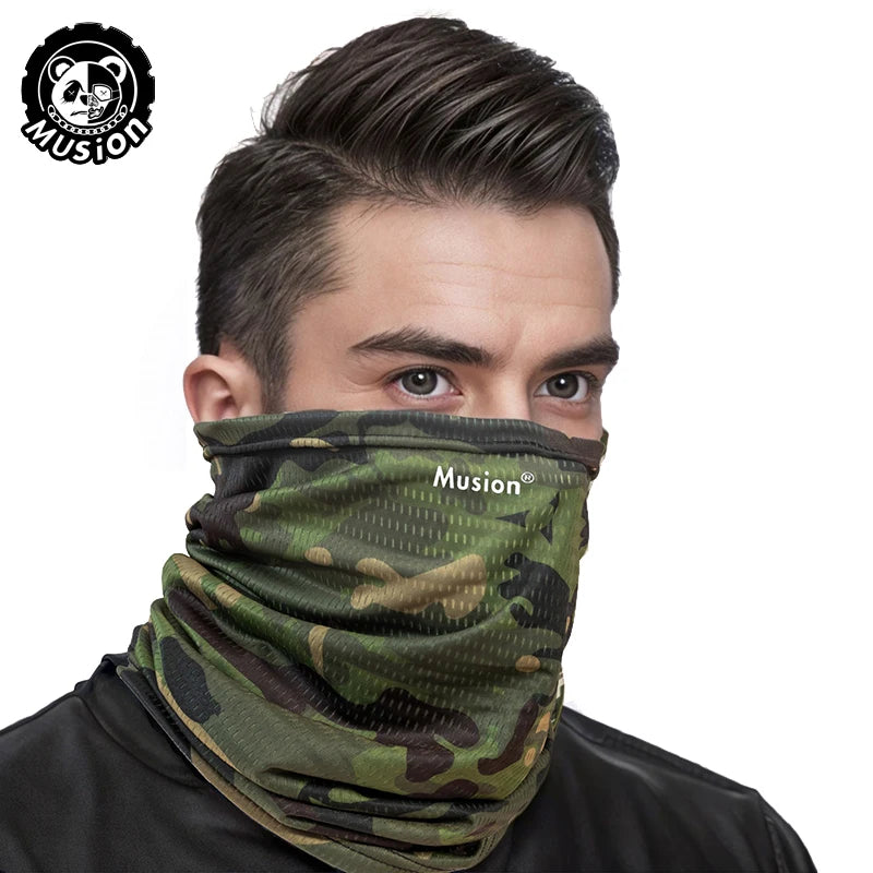 A man wearing a camouflage patterned Musion mask scarf on his face.
