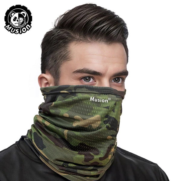 A man wearing a camouflage patterned Musion mask scarf on his face.
