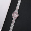 A silver-toned watch with a pink diamond rhinestone bezel and a matching bracelet on a black background.