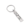 Silver keychain with a circular ring and a rectangular tag engraved with the message I Love You more I win.