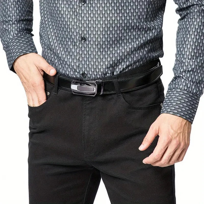 A man wearing a black shirt and black pants with a genuine leather ratchet belt.