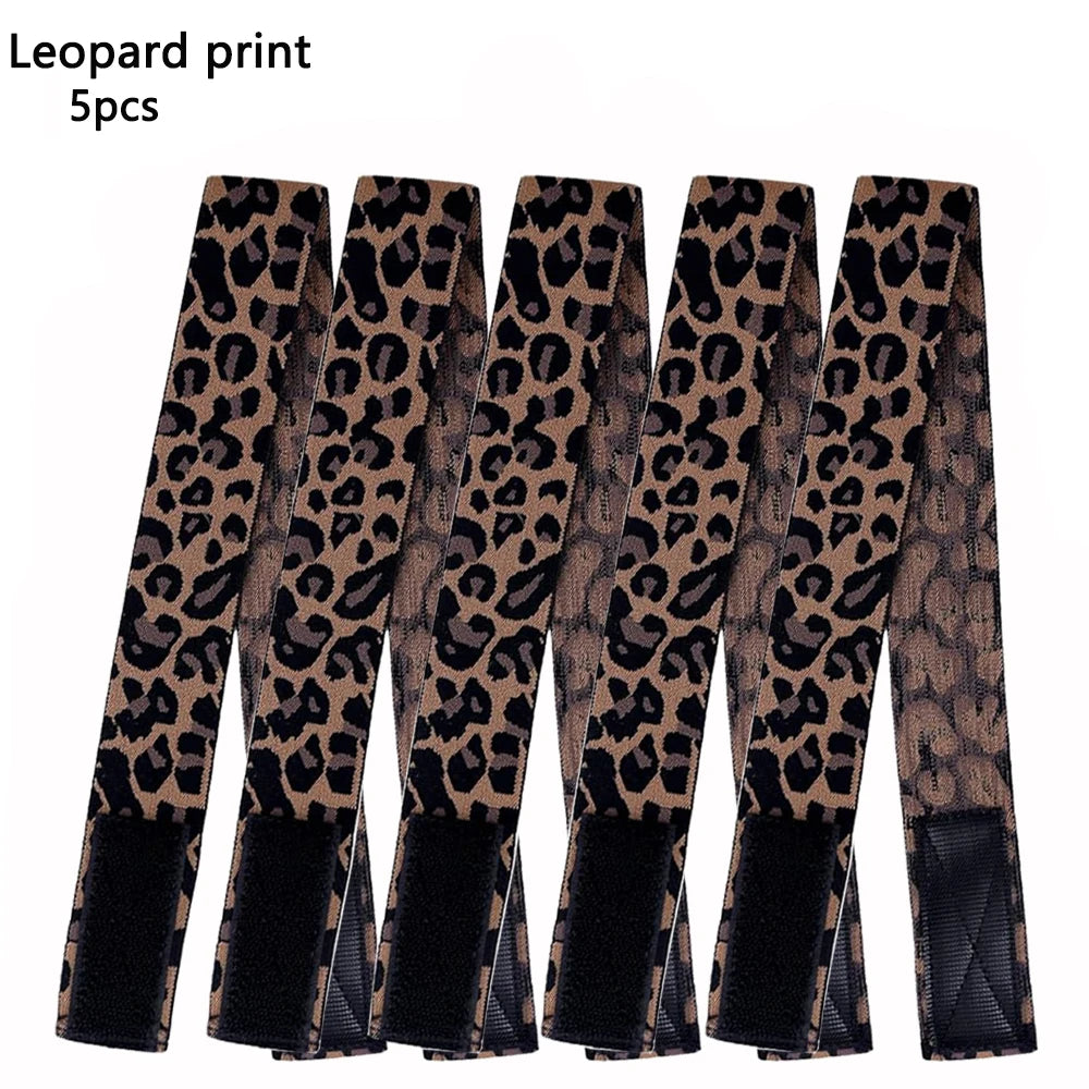 A set of five leopard print adjustable lace headbands for wigs and scarves.
