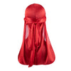 A vibrant red silky durag shower cap bandana tied around the head and draped down