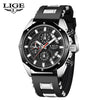 A black and silver men's luxury quartz sport watch with a chronograph display on a wrist.