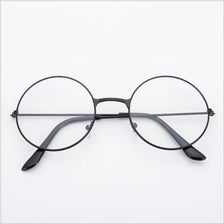 Un par de gafas redondas de metal negro anti-luz azul vistas desde el frente.