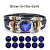 Eine Sammlung leuchtender Lederarmbänder mit Tier- und mystischen Designs.