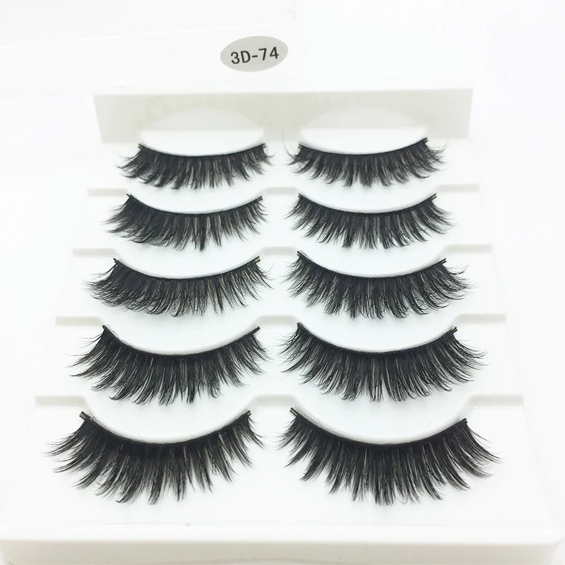 A display of ten pairs of black mink false eyelashes arranged in rows on a white plastic tray.