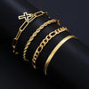A set of gold-toned stainless steel jewelry including a cross, a chain bracelet, and a thick curb chain bracelet.