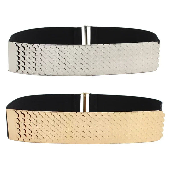 A wide belt featuring a textured, scale-like pattern in white or beige leather with a silver buckle.