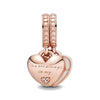 Rose gold cherry blossom charm pendant featuring a heart shape and layered chains.