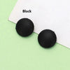 A black silicone eyeglass grip is shown against a white background.