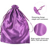 A purple satin wig storage bag with a drawstring design, showing the fabric texture and closure.