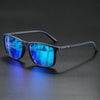 Vintage square polarized cycling sunglasses with blue mirrored lenses resting on a dark surface.