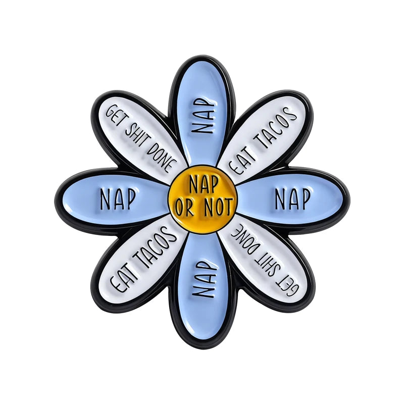 A flower brooch set with ten enamel petals, each engraved with a different phrase like Get Shit Done or Eat Tacos.