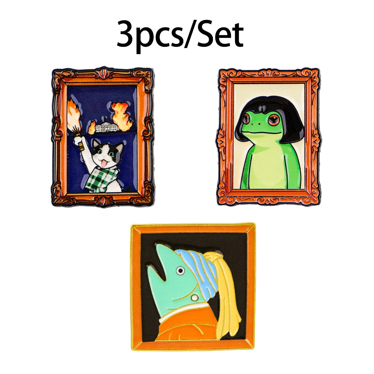 A set of three enamel brooches featuring a cat, a frog, and a blue-green creature.