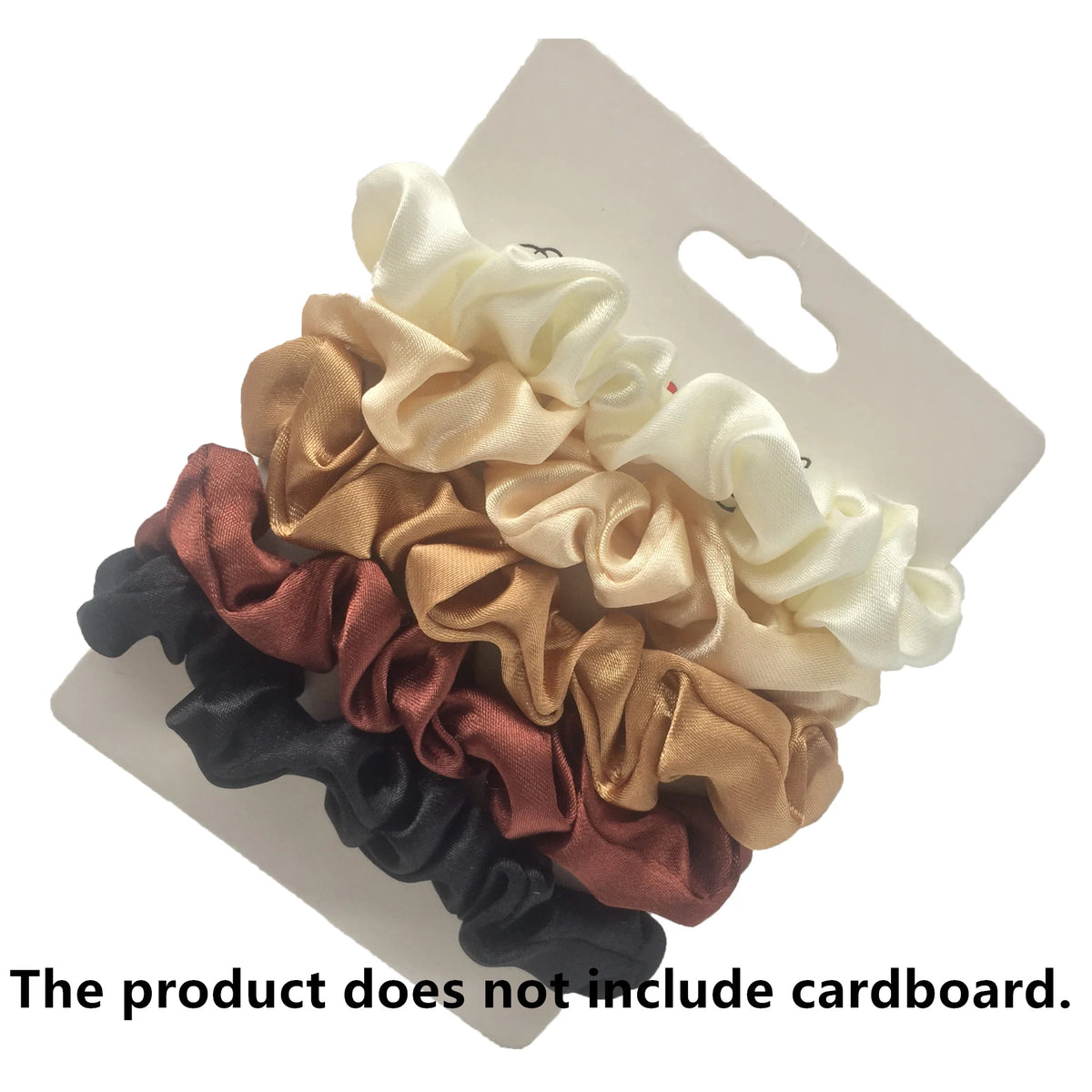 A set of five satin hair scrunchies in shades of beige, gold, rose, and black displayed on a white cardboard backing.