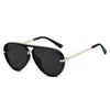 Black aviator style sunglasses with gold accents shown against a white background