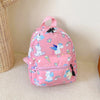 A pink kids backpack featuring a cute dinosaur and unicorn pattern with pastel clouds and rainbows.