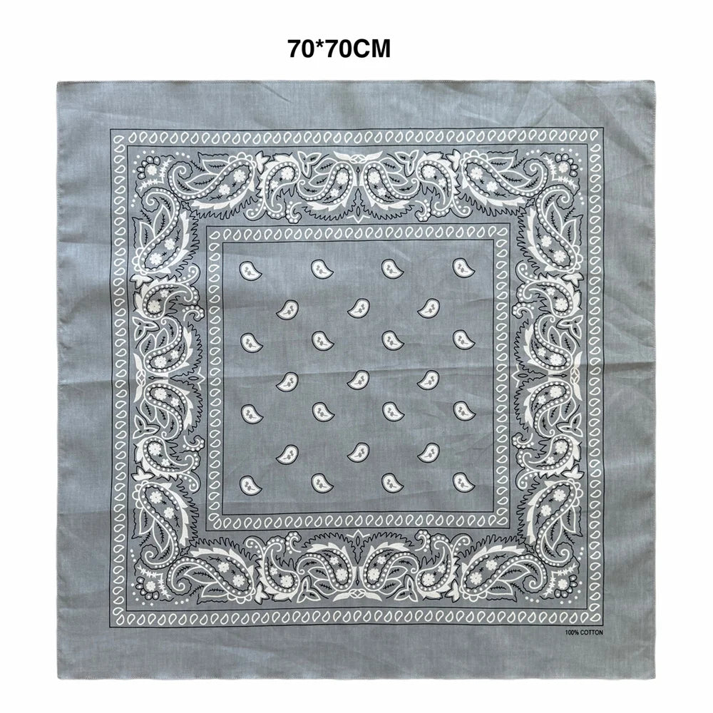 Gray cotton scarf featuring an ornate paisley border and a pattern of small white paisley shapes.