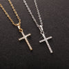 Two stainless steel zircon cross pendant necklaces displayed on a dark surface.