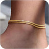 Gold silver plated adjustable beaded anklets worn on a person's ankle.