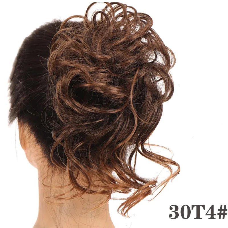 A close-up of messy brown synthetic hair styled in a bun on the back of a person's head.