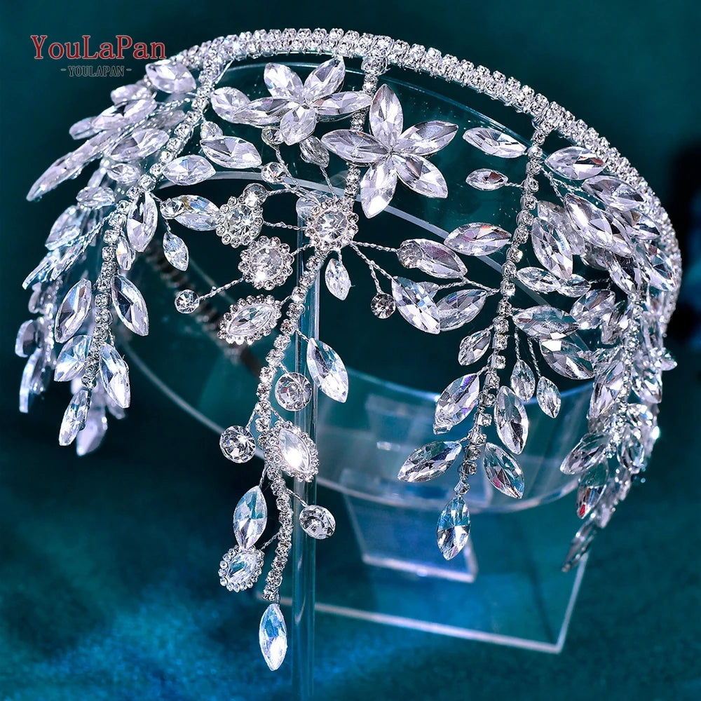 A sparkling rhinestone bridal hair hoop featuring intricate floral and leaf designs.