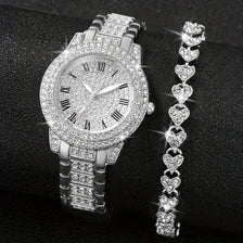 A silver rhinestone heart watch set featuring a wristwatch and a matching heart-shaped bracelet.