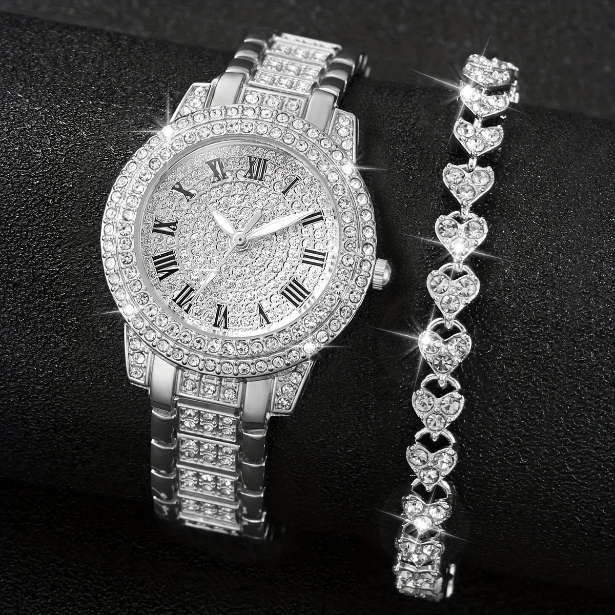 A silver rhinestone heart watch set featuring a wristwatch and a matching heart-shaped bracelet.