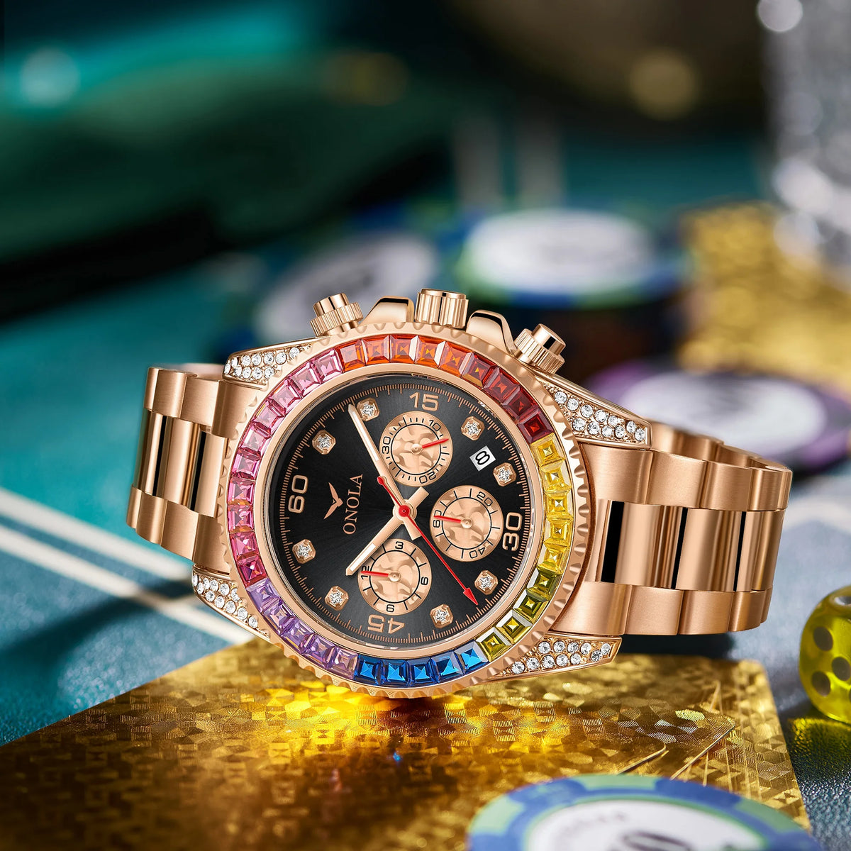 A men's gold quartz watch with diamond accents displayed on a textured gold surface.