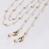 Gold chain lanyard with pearl beads and a gold letter charm