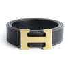 A black genuine leather dress belt with a gold-toned buckle.