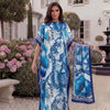 A woman models a blue and white tropical floral print abaya scarf outdoors.