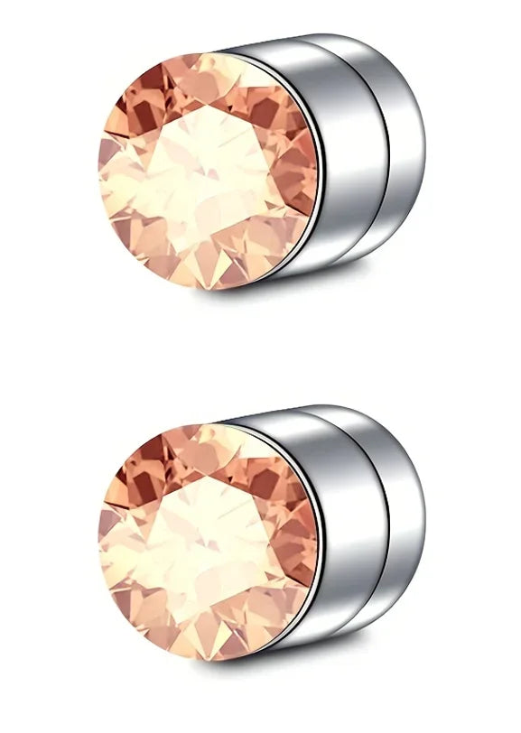 A close-up view of a magnetic nose stud earring featuring a rose-gold colored cubic zirconia stone set in stainless steel.