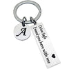 Silver keychain with an initial A and the text Drive Safe I need you here with me