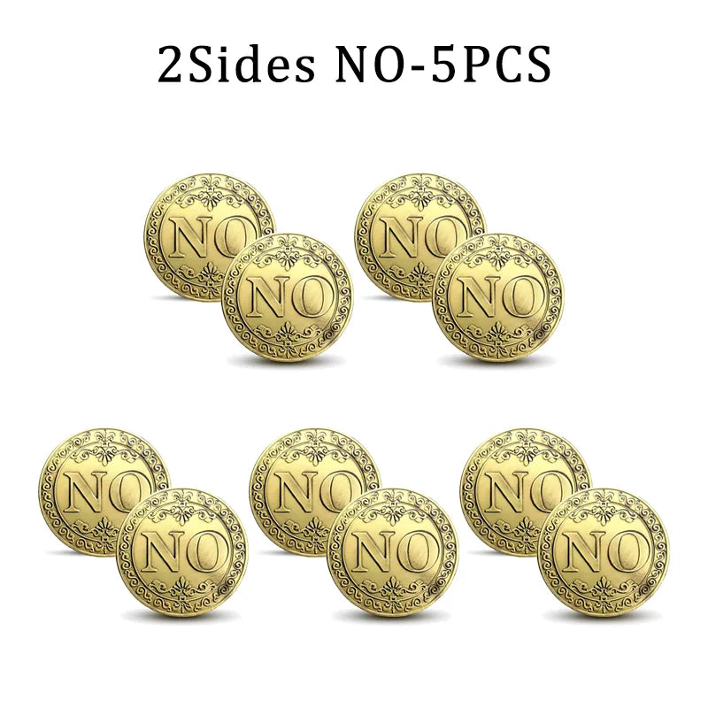 Five vintage antique bronze decision coins stacked and scattered on a white background.