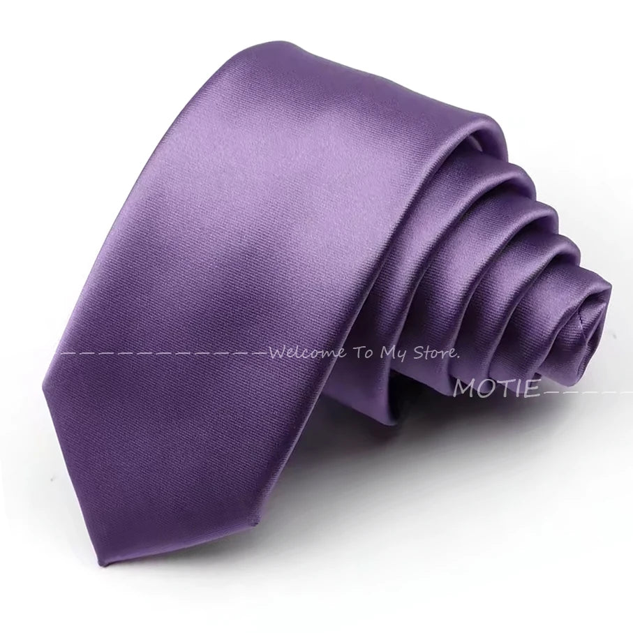 A purple satin neck tie folded and displayed on a white background.