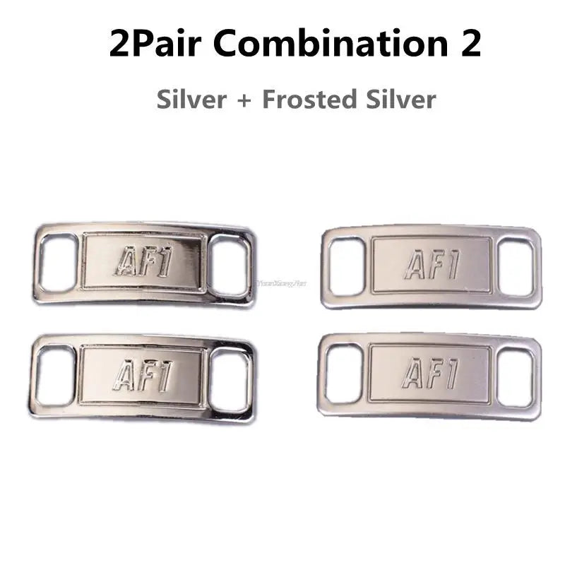 Two pairs of silver and frosted silver AF1 diamond shoe charms and laces