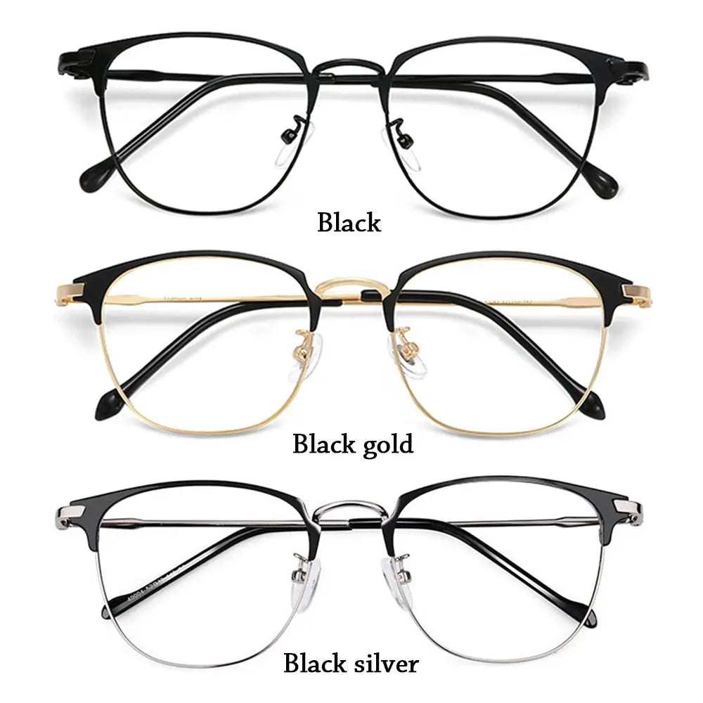 A set of black, black gold, and black silver metal eyeglasses displayed against a white background.