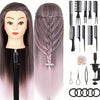 A display of professional cosmetology practice mannequin heads with long gray hair, styling tools, and hair extensions.